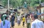 This photo taken on May 24, 2024 shows Rohingya refugees walking down a path at a Rohingya refugee camp in Ukhia in Bangladesh's southeastern Cox's Bazar district. (Photo by AFP) 