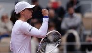 Poland's Iga Swiatek reacts after a point during her women's singles round of sixteen match against Russia's Anastasia Potapova on Court Philippe-Chatrier on day eight of the French Open tennis tournament at the Roland Garros Complex in Paris on June 2, 2024. (Photo by Dimitar DILKOFF / AFP)
