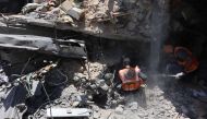 Members of the Palestinian civil defence search through the rubble of a building after it was hit in an Israeli strike in the Jabalia refugee camp in the northern gaza on June 1, 2024. (Photo by Omar AL-QATTAA / AFP)
