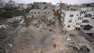 Palestinians inspect the damage after an Israeli strike in Nuseirat, in the central Gaza Strip, on June 3, 2024. (Photo by Bashar Taleb / AFP)
