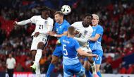 England's midfielder #21 Eberechi Eze (left) wins a header from Iceland's midfielder #15 Bjarki Bjarkason (2nd left) during the International friendly football match between England and Iceland at Wembley Stadium in London on June 7, 2024. (Photo by Henry Nicholls / AFP)