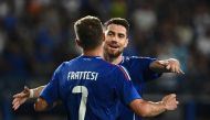 Italy's midfielder Davide Frattesi celebrates with teammate Italy's midfielder Jorginho after scoring his team first goal during the International friendly football match between Italy and Bosnia-Herzegovina in Empoli on June 09, 2024. (Photo by Isabella Bonotto / AFP)

