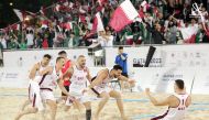 Qatar players celebrate after winning the 2023 IHF Beach Handball Global Tour final, in this file photo.