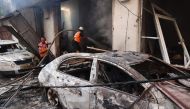 Palestinian firefighters battle a flame a day after an operation by the Israeli Special Forces in the Nuseirat camp, in the central Gaza Strip on June 9, 2024. (Photo by Eyad Baba / AFP)