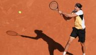 Germany's Alexander Zverev plays a backhand return to Spain's Carlos Alcaraz during their men's singles final match on Court Philippe-Chatrier on day fifteen of the French Open tennis tournament at the Roland Garros Complex in Paris on June 9, 2024. (Photo by Dimitar DILKOFF / AFP)