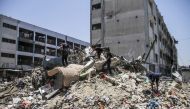 AZA, June 14, 2024 (Xinhua) -- People collect items from the rubble ahead of Eid al-Adha at the Jabalia refugee camp in the northern Gaza Strip, on June 14, 2024. (Photo by Mahmoud Zaki/Xinhua)