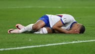 France's forward Kylian Mbappe lies on the football pitch after being injured during the UEFA Euro 2024 Group D football match between Austria and France at the Duesseldorf Arena in Duesseldorf on June 17, 2024. (Photo by OZAN KOSE / AFP)