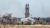 Smoke plumes billow during ongoing battles in the Sultan neighbourhood in the northwest of Rafah in the southern Gaza Strip on June 18, 2024 amid the ongoing conflict in the Palestinian territory (Photo by Bashar TALEB / AFP)