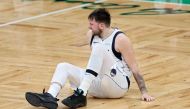 Luka Doncic #77 of the Dallas Mavericks reacts after slipping against the Boston Celtics during the fourth quarter of Game Five of the 2024 NBA Finals at TD Garden on June 17, 2024 in Boston, Massachusetts. (Photo by Adam Glanzman / GETTY IMAGES NORTH AMERICA / Getty Images via AFP)
