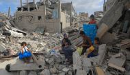 Emad Abu Hamad and his family are pictured in Bani Suhaila town in eastern Khan Younis city in the south of Gaza, on June 17, 2024. (Photo by Rizek Abdeljawad/Xinhua)