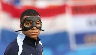 France's forward #10 Kylian Mbappe walks on the pitch during warm up prior to the UEFA Euro 2024 Group D football match between the Netherlands and France at the Leipzig Stadium in Leipzig on June 21, 2024. (Photo by Franck Fife / AFP)
