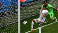 Czech Republic's forward #10 Patrik Schick (L) kicks the ball to score his team's first goal next to Georgia's goalkeeper #25 Giorgi Mamardashvili during the UEFA Euro 2024 Group F football match between Georgia and the Czech Republic at the Volksparkstadion in Hamburg on June 22, 2024. (Photo by Christophe SIMON / AFP)
