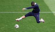 France's forward #10 Kylian Mbappe kicks the ball during a training session at the Home Deluxe Arena Stadium in Paderborn, western Germany, on June 23, 2024, during of the UEFA Euro 2024 football championship. (Photo by Franck Fife / AFP)