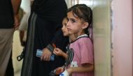 Palestinian children suffering of malnutrition or chronic diseases such as cancer, wait with family members at Nasser hospital in Khan Yunis in the southern Gaza Strip on June 24, 2024. (Photo by Bashar Taleb / AFP)