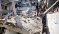 A man stands in the rubble of the house of the sister of Ismail Haniyeh, after it was hit by Israeli bombardment in the Shati camp for Palestinian refugees west of Gaza City on June 25, 2024. (Photo by Omar Al-Qattaa / AFP)