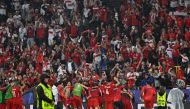 Turkiye's players celebrate with their supporters after the UEFA Euro 2024 Group F football match between Turkey and Georgia at the BVB Stadion in Dortmund on June 18, 2024. (Photo by INA FASSBENDER / AFP)