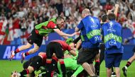 Georgia's players celebrate after winning the UEFA Euro 2024 Group F football match between Georgia and Portugal at the Arena AufSchalke in Gelsenkirchen on June 26, 2024. (Photo by Patricia De Melo Moreira / AFP)