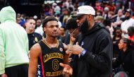 (FILES) Bronny James #6 of the West team talks to Lebron James of the Los Angeles Lakers after the 2023 McDonald's High School Boys All-American Game at Toyota Center on March 28, 2023 in Houston, Texas. (Photo by Alex Bierens de Haan / GETTY IMAGES NORTH AMERICA / AFP)
