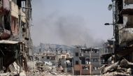 Smoke billows from an area targeted by Israeli bombardment in the Gaza City district of Shujaiya on June 28, 2024. (Photo by Omar Al-Qattaa / AFP)