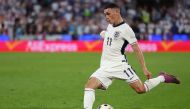 England's midfielder #11 Phil Foden crosses the ball during the UEFA Euro 2024 Group C football match between England and Slovenia at the Cologne Stadium in Cologne on June 25, 2024. (Photo by Adrian DENNIS / AFP)