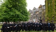 Graduates from Qatar campus along with officials in Scotland.