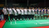 Chinese badminton players and coaches (in white jackets and black armbands), along with all players competing in the 2024 Asia Junior Championship, praying together for the late Chinese player Zhang Zhi Jie. (Photo by Handout / public relations and media division of the Indonesian Badminton Association (PBSI) / AFP)