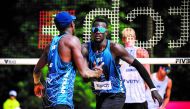 Qatar's Cherif Younousse and Ahmed Tijan celebrate after defeating USA's Chase Budinger and Miles Evans in their opening match of Elite16 Volleyball World Beach Pro Tour encounter in Gstaad, Switzerland, yesterday.