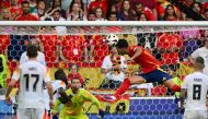 Spain's midfielder #06 Mikel Merino (CR) heads the ball and scores his team's second goal during the UEFA Euro 2024 quarter-final football match between Spain and Germany at the Stuttgart Arena in Stuttgart on July 5, 2024. (Photo by Fabrice COFFRINI / AFP)
