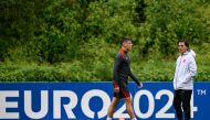 Turkiye's midfielder Arda Guler (L) and Italian head coach Vincenzo Montella (R) attend a training session on July 5, 2024. (Photo by Ozan Kose / AFP)