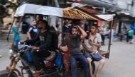 A tuktuk driver rushes to transport casualties after Israeli bombardment at al-Bureij refugee camp in the central Gaza Strip on July 8, 2024. (Photo by Eyad Baba / AFP)