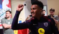 England's forward Ollie Watkins plays darts ahead of a press conference at the Weimarer Land Golf resort near Blankenhain on July 12, 2024. (Photo by Adrian DENNIS / AFP)
