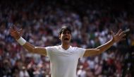 Spain's Carlos Alcaraz celebrates beating Serbia's Novak Djokovic during their men's singles final tennis match on the fourteenth day of the 2024 Wimbledon Championships at The All England Lawn Tennis and Croquet Club in Wimbledon, southwest London, on July 14, 2024.(Photo by HENRY NICHOLLS / AFP) 