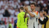 (Files) Germany's forward #13 Thomas Mueller greets the fans after the UEFA Euro 2024 quarter-final football match between Spain and Germany on July 5, 2024. (Photo by Lluis Gene / AFP)