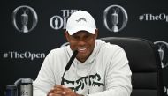 US golfer Tiger Woods smiles during a press conference held ahead of the 152nd British Open Golf Championship at Royal Troon on the south west coast of Scotland on July 16, 2024. (Photo by Paul ELLIS / AFP) / RESTRICTED TO EDITORIAL USE
