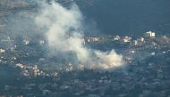 Smoke bilows following an Israeli strike in the village of Kfar Kila in southern Lebanon on July 16, 2024, amid continuing tensions on the Lebanese-Israeli border. (Photo by Rabih DAHER / AFP)
