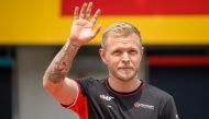 Haas F1's Danish driver Kevin Magnussen waves as he arrives to attend the Drivers Parade ahead of the Formula One Austrian Grand Prix on the Red Bull Ring race track in Spielberg, Austria, on June 30, 2024. (Photo by Jure Makovec / AFP)
