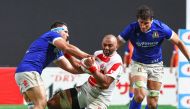 Japan's Michael Leitch (C) is challenged during the international rugby test match between Japan and Italy at Sapporo Dome in Hokkaido on July 21, 2024. (Photo by JIJI PRESS / AFP) / Japan OUT
