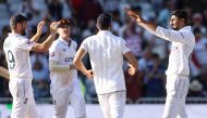 England's Shoaib Bashir (R) celebrates with teammates after taking the last wicket of West Indies Shamar Joseph to win the second Test cricket match between England and West Indies at Trent Bridge in Nottingham on July 21, 2024. (Photo by Darren Staples / AFP)