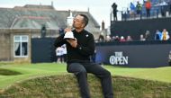 US golfer Xander Schauffele kisses the Claret Jug, the trophy for the Champion golfer of the year after winning the 152nd British Open Golf Championship at Royal Troon on the south west coast of Scotland on July 21, 2024. (Photo by Glyn KIRK / AFP) / RESTRICTED TO EDITORIAL USE
