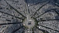 An aerial view shows the Arc de Triomphe during the annual Bastille Day military parade on the Champs-Elysees avenue in Paris on July 14, 2017.  Photo by JEAN-SEBASTIEN EVRARD / AFP