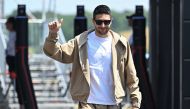 Alpine's French driver Esteban Ocon arrives at the Hungaroring race track in Mogyorod near Budapest on July 18, 2024, ahead of the Formula One Hungarian Grand Prix. (Photo by Attila KISBENEDEK / AFP)
