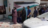 Palestinians flee from a school where they has taken refuge, after it was hit by an Israeli strike, in Deir el-Balah in the central Gaza Strip on July 27, 2024. (Photo by Bashar Taleb / AFP)
 