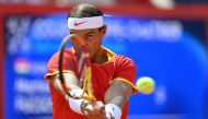 Spain's Rafael Nadal warms up ahead of his men's singles first round tennis match against Hungary's Marton Fucsovics on Court Philippe-Chatrier at the Roland-Garros Stadium at the Paris 2024 Olympic Games, in Paris on July 28, 2024. (Photo by Miguel MEDINA / AFP)