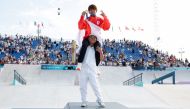 Gold medallist Japan's Yuto Horigome is carried on the podium after the victory ceremony for the men's street skateboarding event during the Paris 2024 Olympic Games at La Concorde in Paris on July 29, 2024. (Photo by Odd Andersen / AFP)