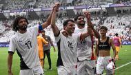 Egypt's midfielders #17 Mohamed Elneny, #14 Ahmed Zizo, #10 Ibrahim Adel and #03 Ahmed Atef celebrate their win at the end of the men's group C football match between Spain and Egypt during the Paris 2024 Olympic Games at the Bordeaux Stadium in Bordeaux on July 30, 2024. (Photo by Philippe Lopez / AFP)
