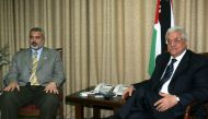 (Files) Palestinian Authority President Mahmoud Abbas (R) meets with Ismail Haniyeh at Abbas' office in Gaza City, Saturday, June 10, 2006. (Photo by Khalil Hamra / AFP)