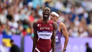 Qatar's Ammar Ismail Yahia Ibrahim reacts after competing in the men's 400m heat of the athletics event at the Paris 2024 Olympic Games at Stade de France in Saint-Denis, north of Paris, on August 4, 2024. (Photo by Martin Bernetti / AFP)