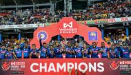 Sri Lanka's players pose with the series trophy after winning the third and final one-day international (ODI) cricket match between Sri Lanka and India at the R. Premadasa International cricket Stadium in Colombo on August 7, 2024. (Photo by Ishara S. Kodikara / AFP)
