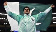 Gold medallist Pakistan's Arshad Nadeem celebrates after winning in the men's javelin throw final of the athletics event at the Paris 2024 Olympic Games at Stade de France in Saint-Denis, north of Paris, on August 8, 2024. (Photo by Ben Stansall / AFP) 