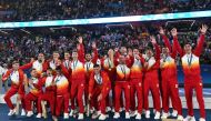 Spain's gold medallists celebrate on the podium after the men's final football match between France and Spain during the Paris 2024 Olympic Games at the Parc des Princes in Paris on August 9, 2024. (Photo by Patricia De Melo Moreira/ AFP)